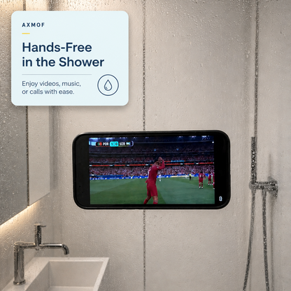 A smartphone mounted on a bathroom wall shows a sports game, with water droplets on the glass shower door and a text overlay reading 'Hands-Free in the Shower' by AXMOF.
